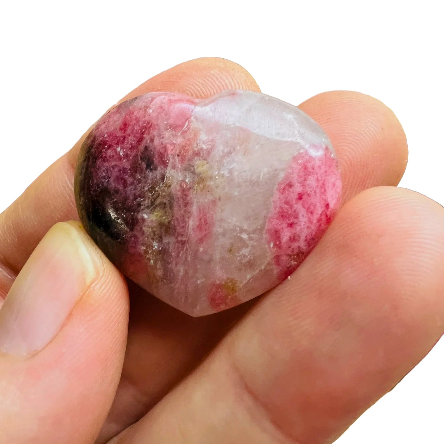 Composed shot of Rhodonite stone, from Atsimo-Andrefana, Madagascar, often kept for Self Love, with depth visible across the surface.