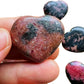 Detail shot of Grade AA Rhodonite heart under natural light