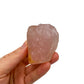 In-hand view of a Rose Quartz specimen kept near for Love, from Madagascar.
