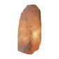 Rose quartz crystal lamp glowing, warm light, ethically sourced from Brazil
