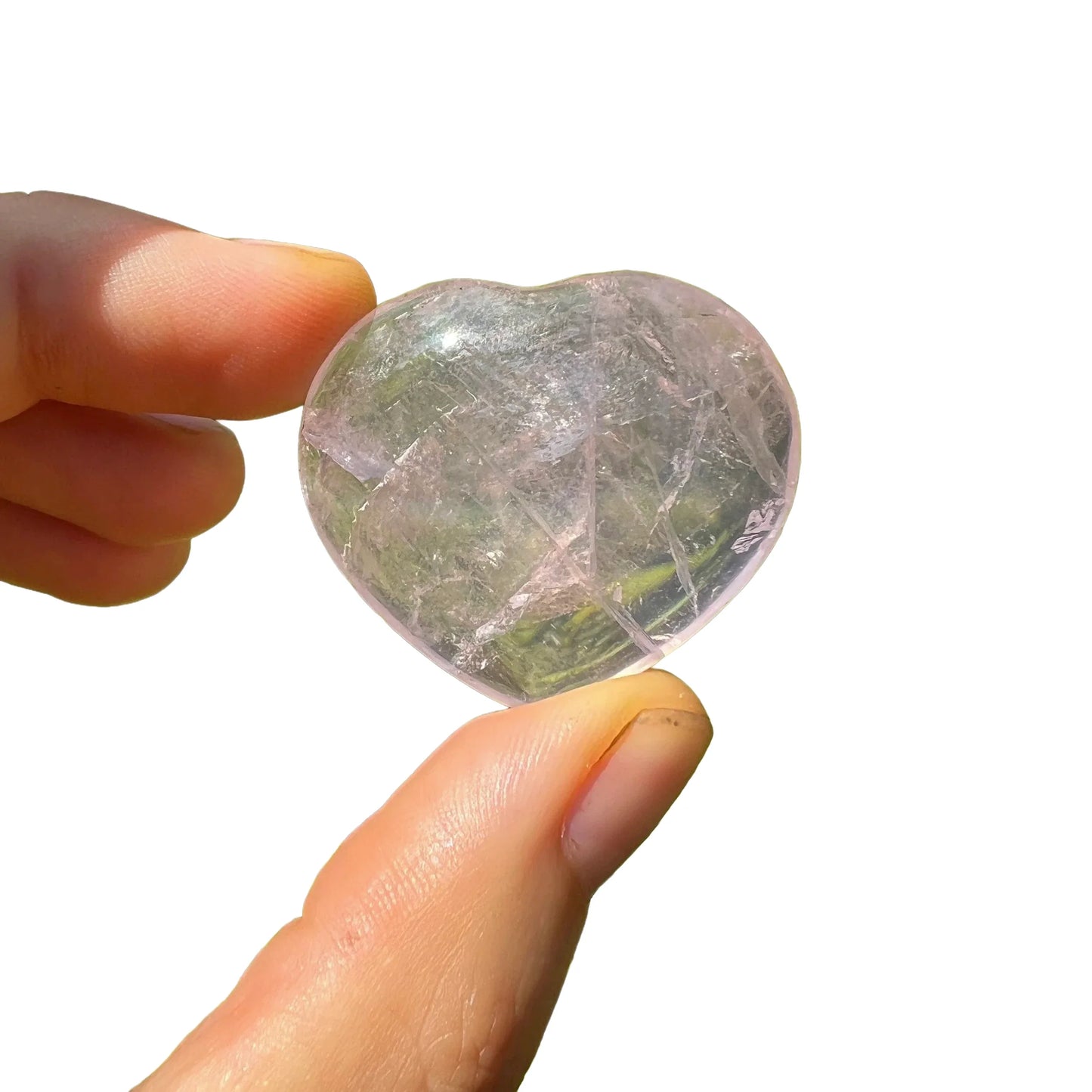 Underside view of Rose Quartz polished heart, hand-selected from Vakinankaratra, Madagascar, turned to for Love.