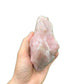Side profile of Rose Quartz specimen, hand-selected from Alaotra-Mangoro, Madagascar, showing natural texture.