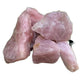 Side perspective of Rose Quartz raw stone, showing characteristic color, often paired with practices around Love and Self Love.