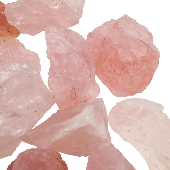 Three-quarter view of Rose Quartz raw crystal, showing the full body of the piece.