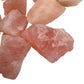 Edge-on view of Grade AA Rose Quartz raw stone, sourced from Namibia, kept near for Love and Self Love.