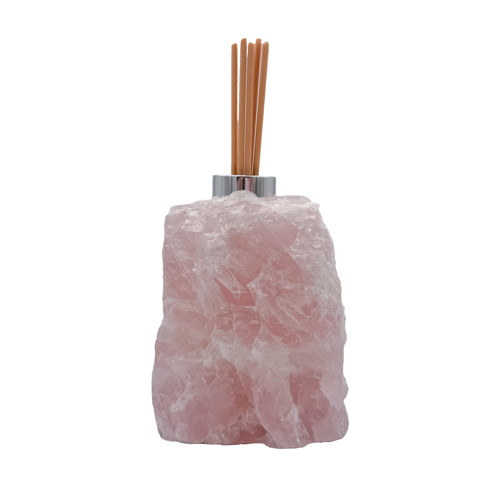Rose quartz reed diffuser angled view showing cloudy pink crystal texture