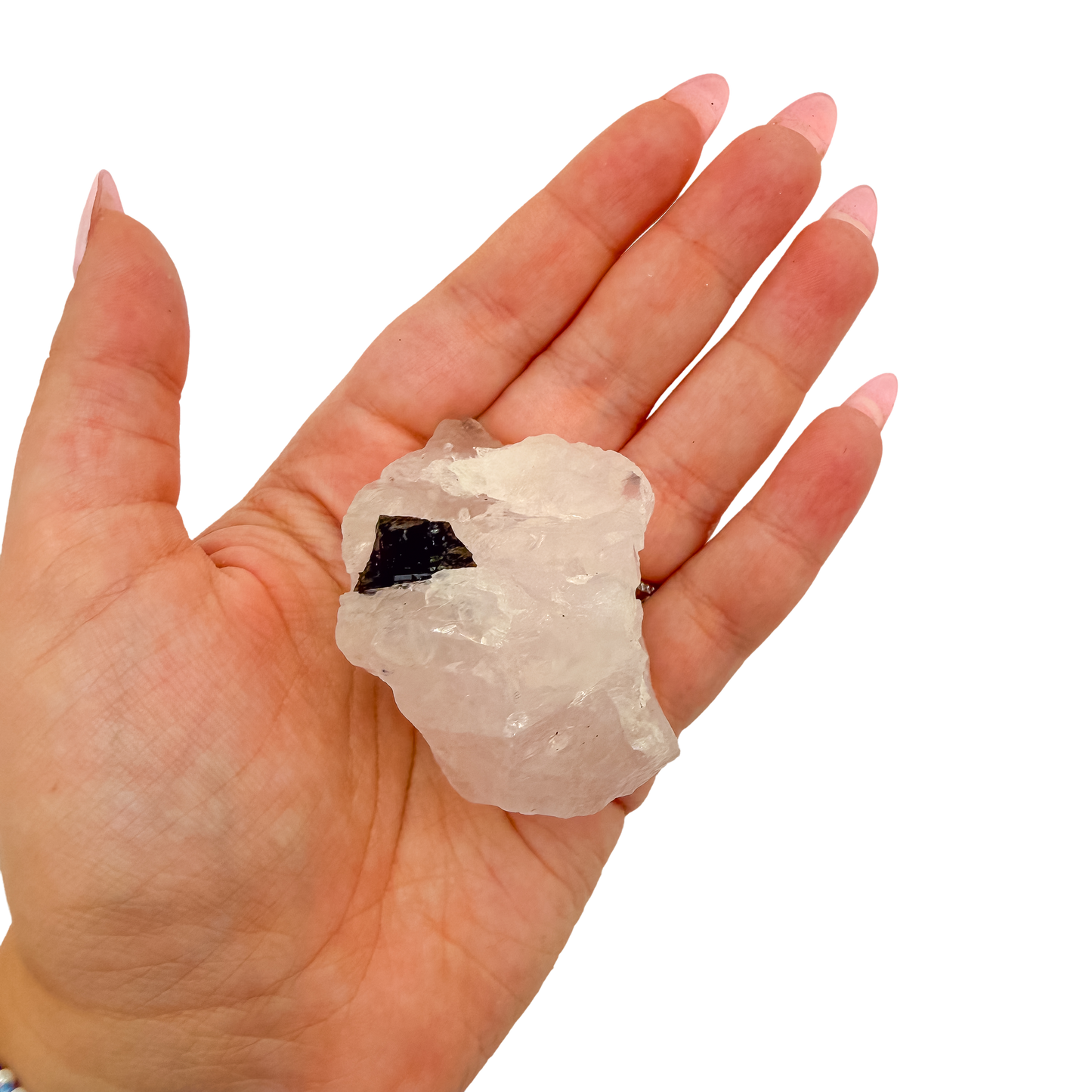 Hand holding the upright pink block to convey its real size, 1.88 inches