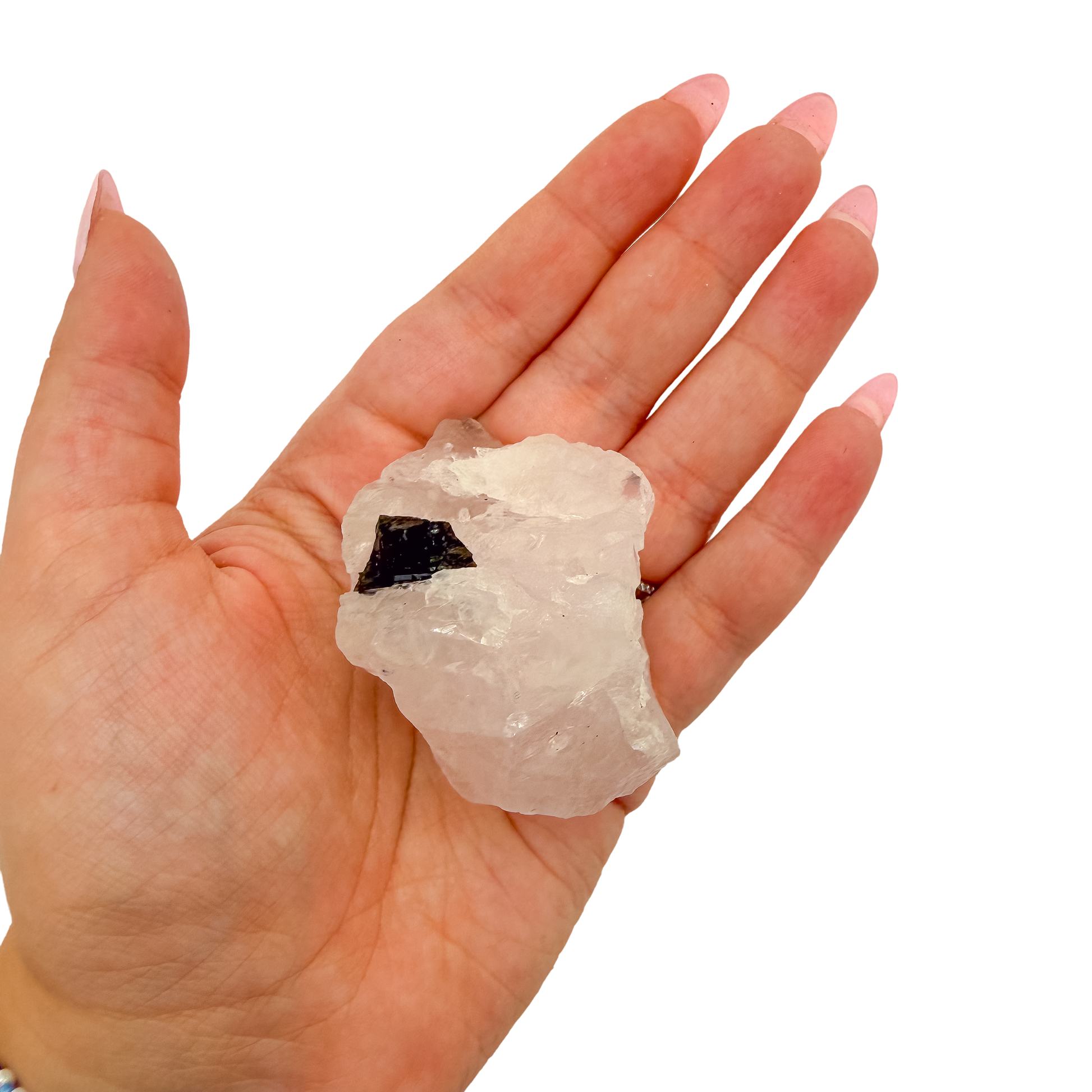Hand holding the upright pink block to convey its real size, 1.88 inches
