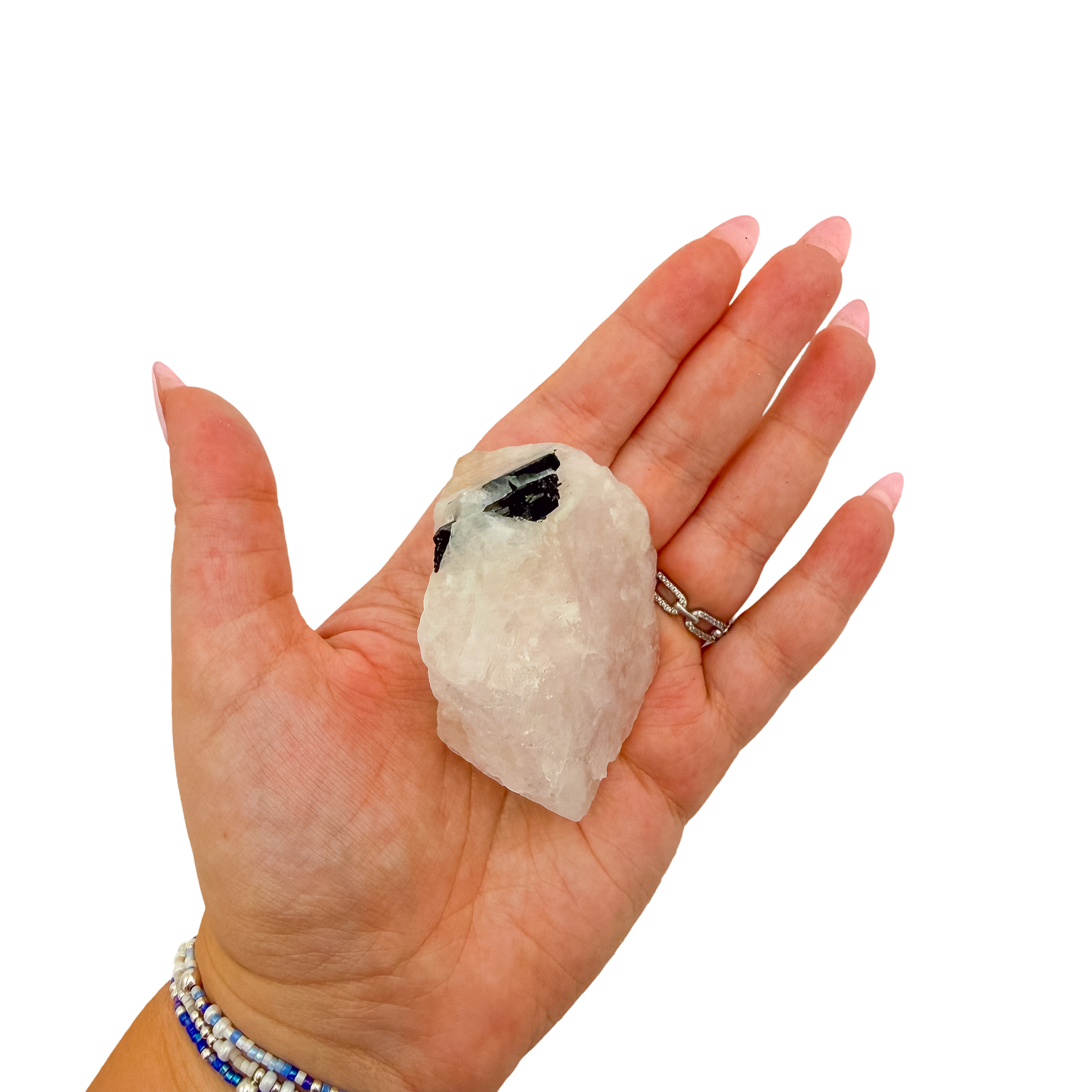Scale shot of the slim standing piece, 98 g of Minas Gerais rose quartz in a hand
