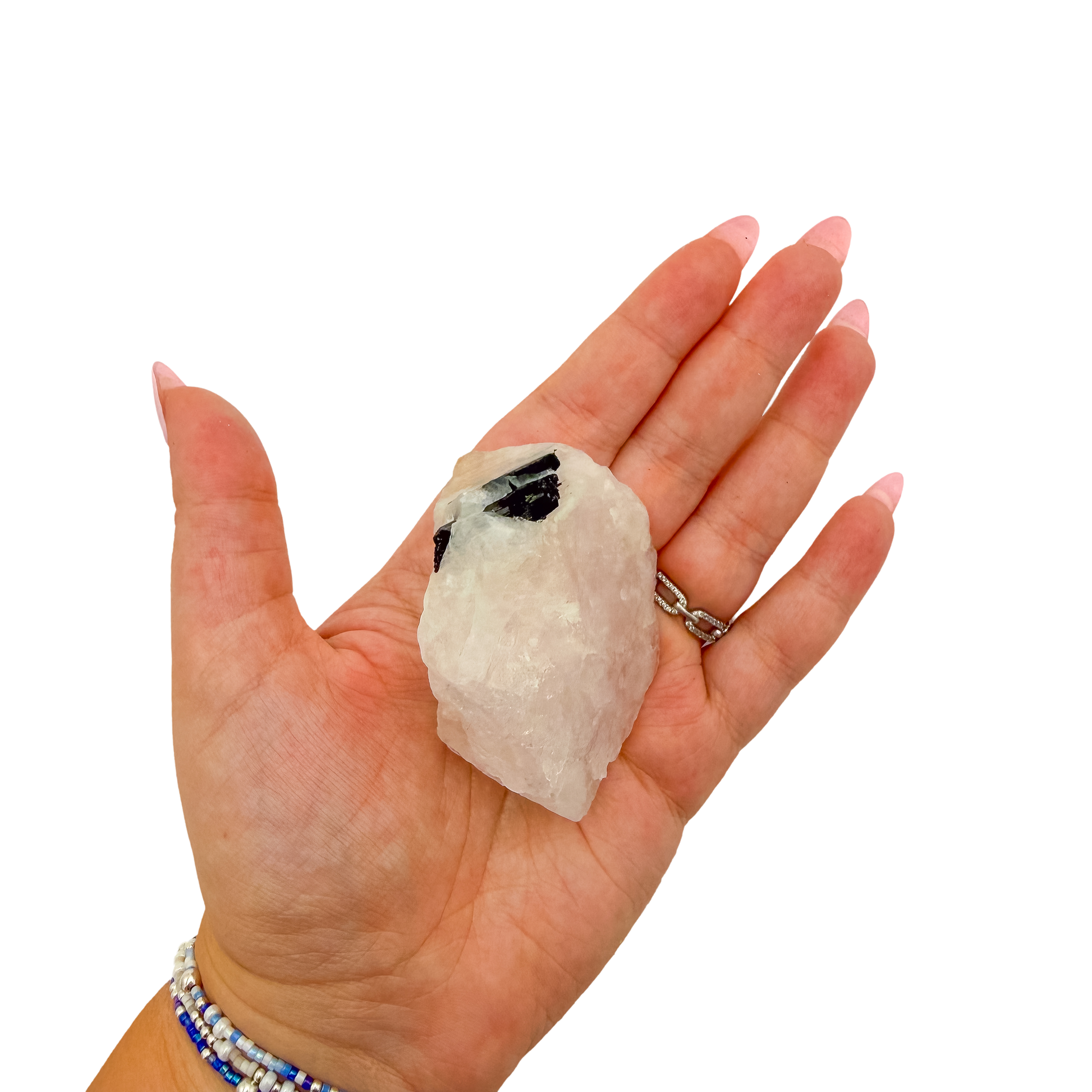 Scale shot of the slim standing piece, 98 g of Minas Gerais rose quartz in a hand