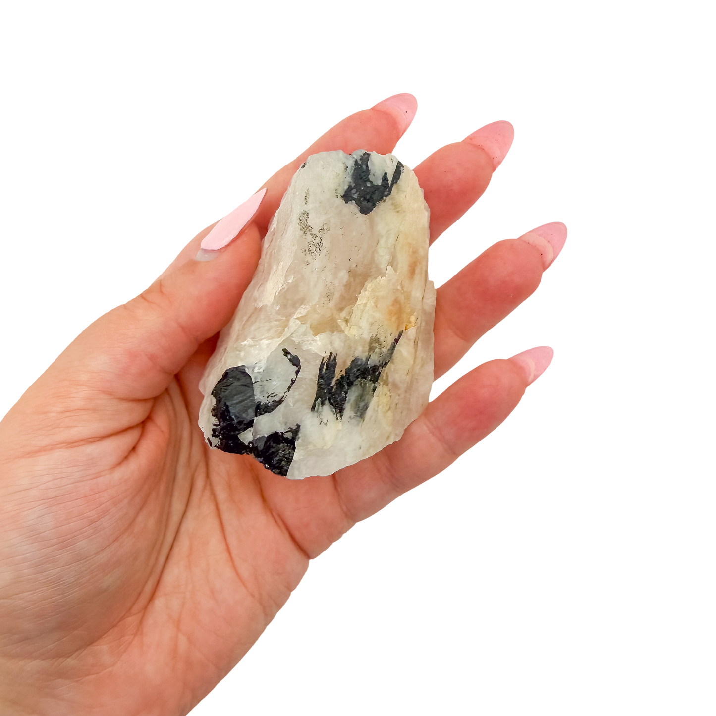 A 172 g rose quartz with tourmaline, the deep pink chunk, resting in an open palm