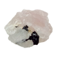 Detail of jet-black crystal against the pale pink of the longest of the lot