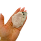 Hand holding the longest of the lot to convey its real size, 3.49 inches