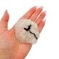 Scale shot of the classic pink form, 144 g of Minas Gerais rose quartz in a hand