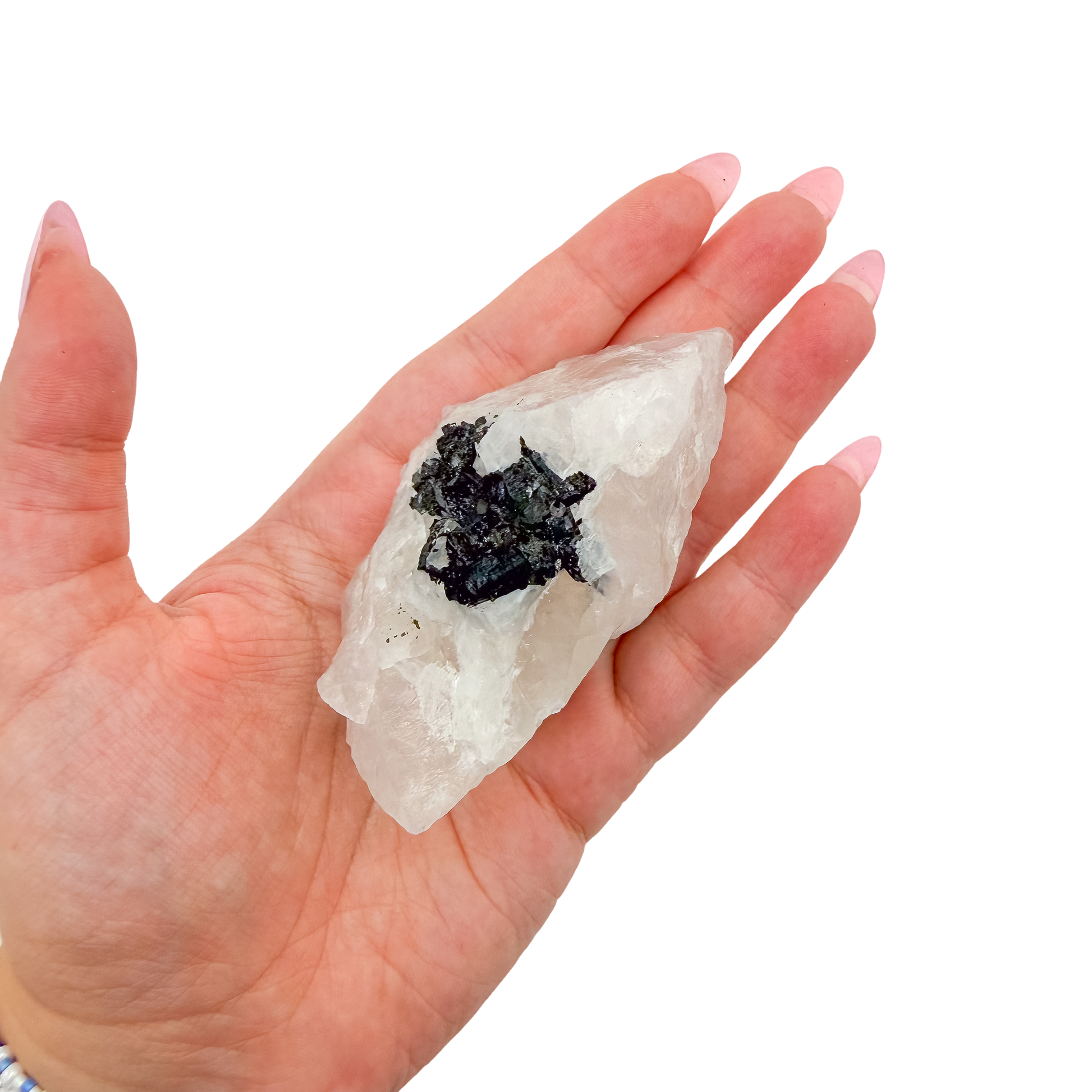 A 163 g rose quartz with tourmaline, the tapered pink piece, resting in an open palm