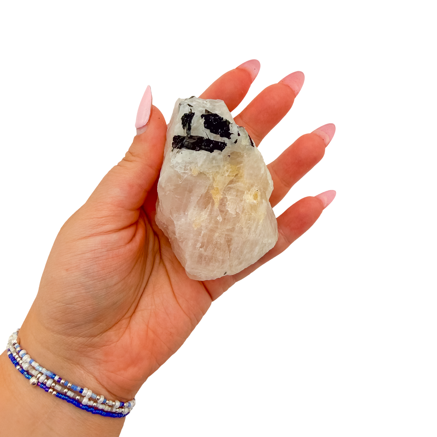 Hand holding the elongated pink body to convey its real size, 2.88 inches