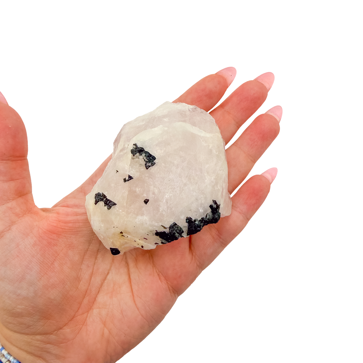 Scale shot of the wide pink face, 224 g of Minas Gerais rose quartz in a hand