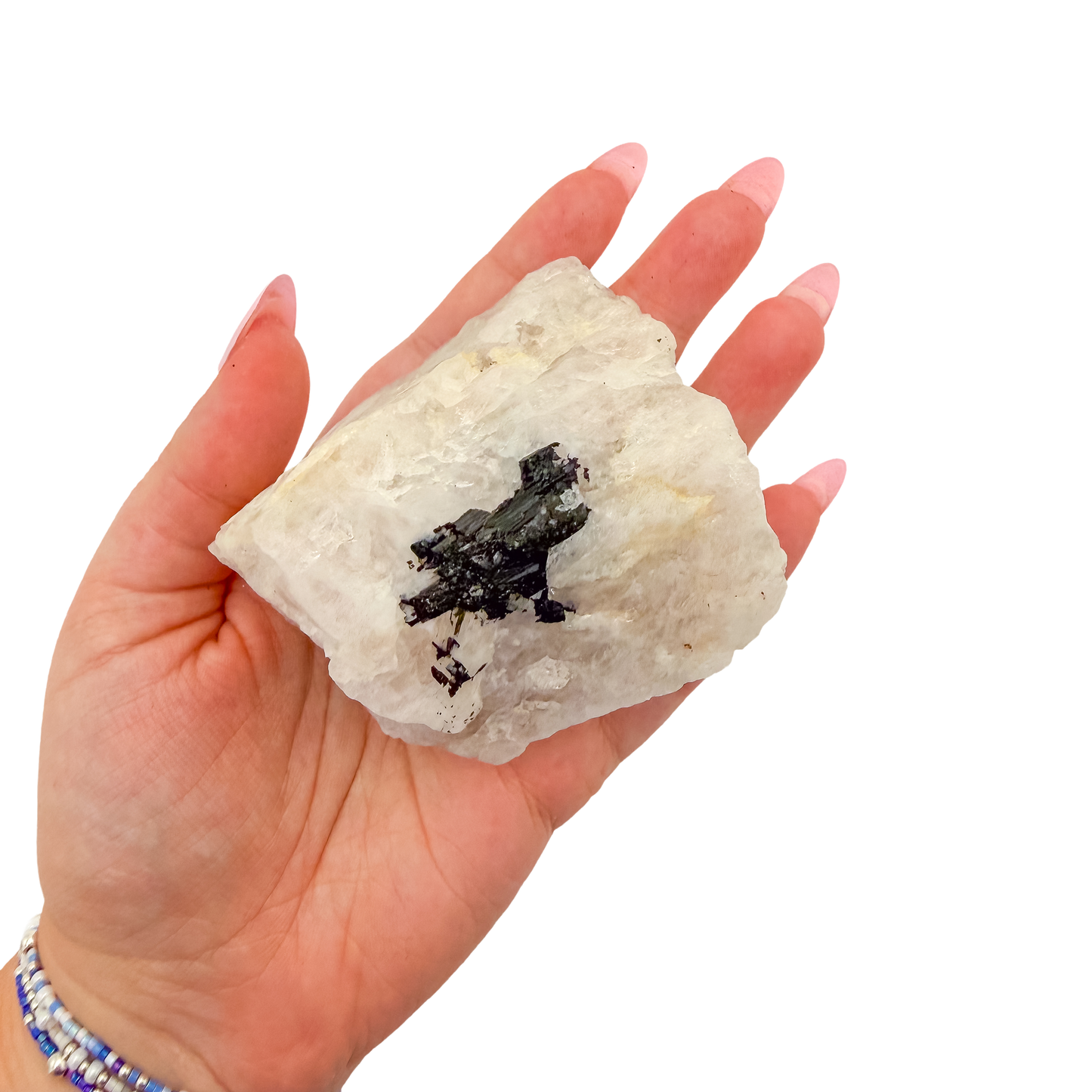 The heaviest of the lot held in a hand, showing the scale of this 2.64 inch specimen
