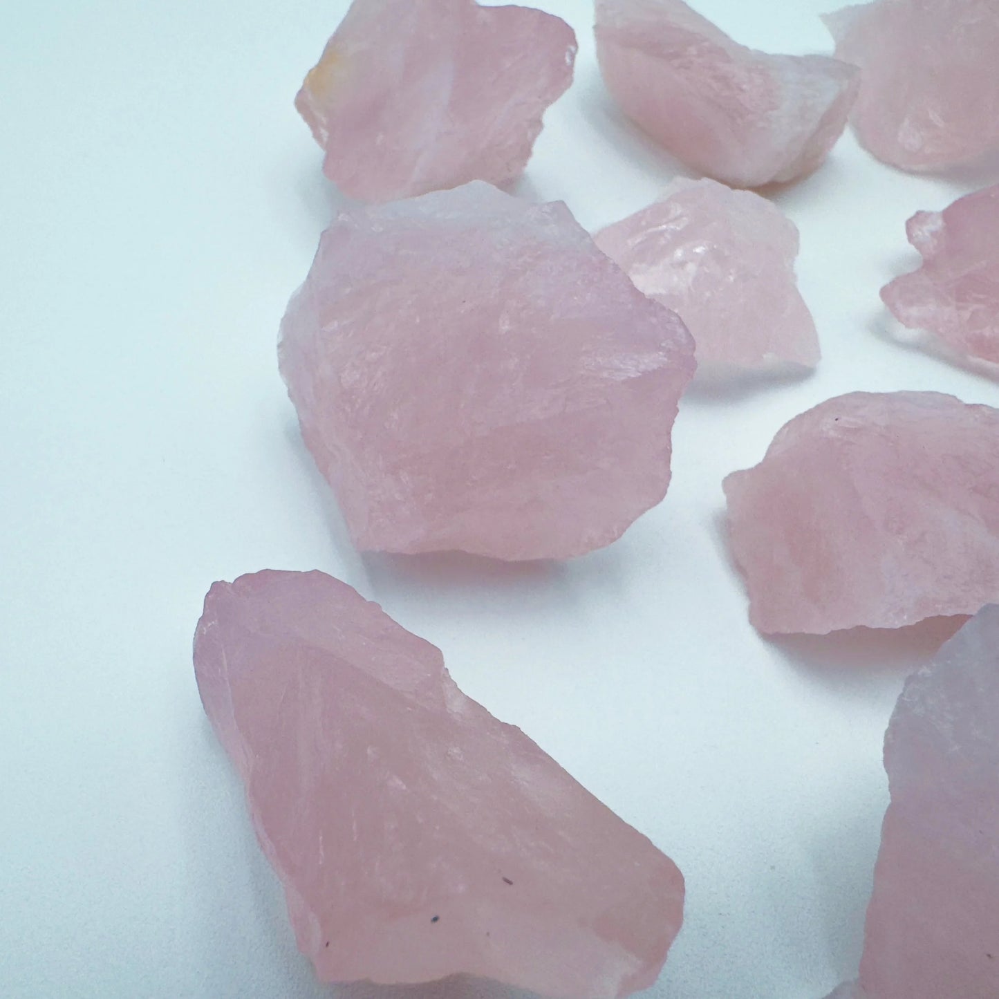 Alternate angle of Grade AA Rose Quartz raw showing overall shape