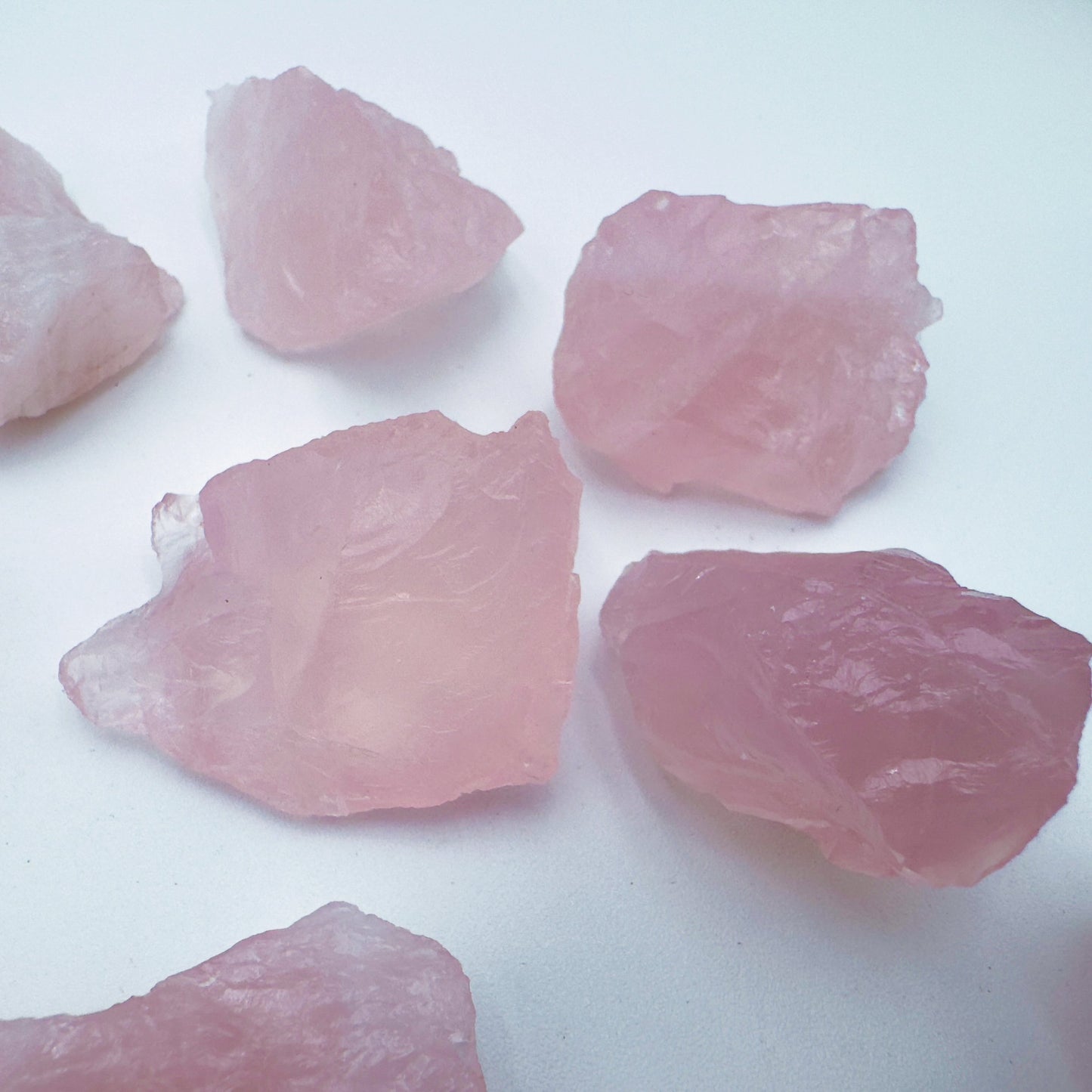Back view of Grade AA Rose Quartz raw showing natural surface