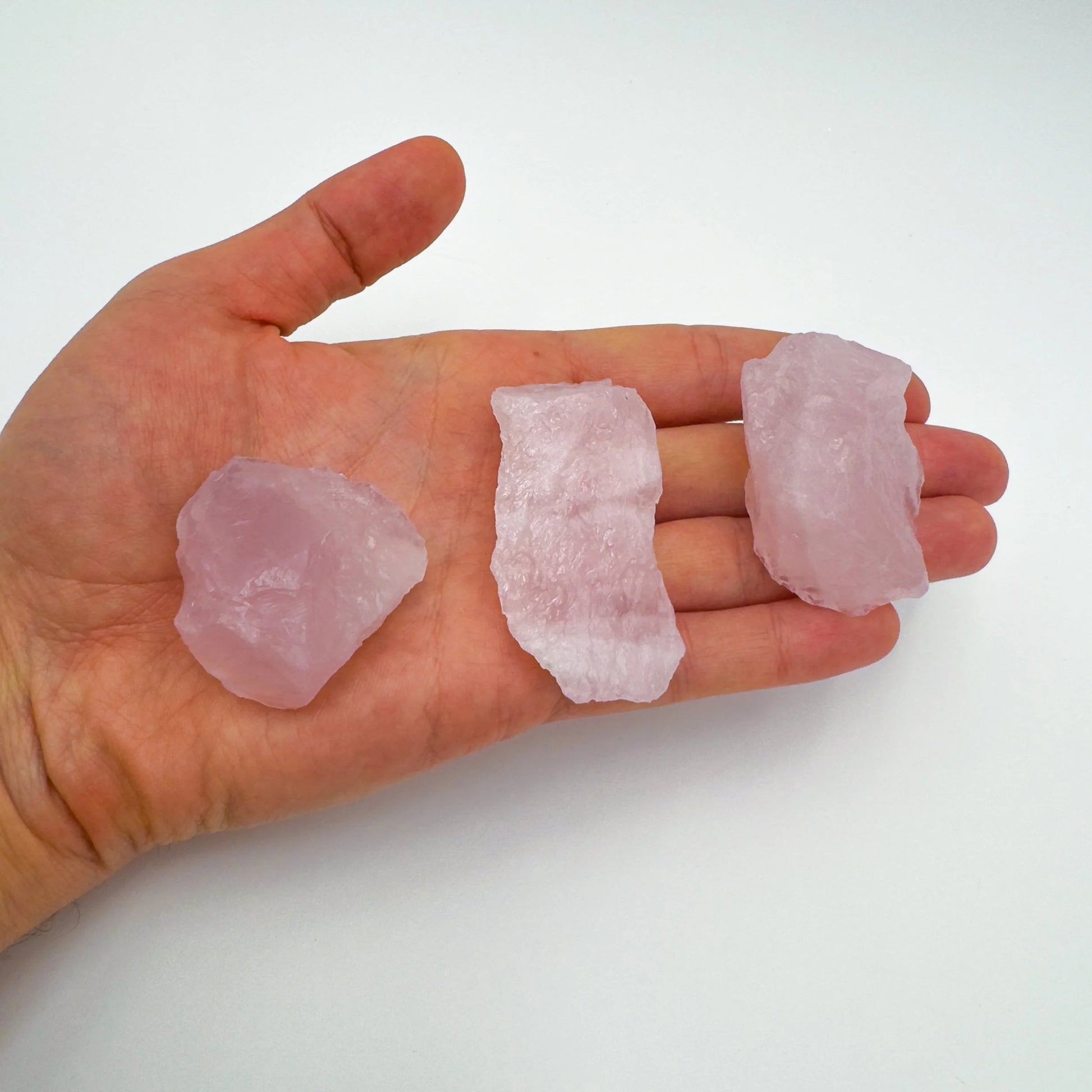 Detail shot of Grade AA Rose Quartz raw under natural light
