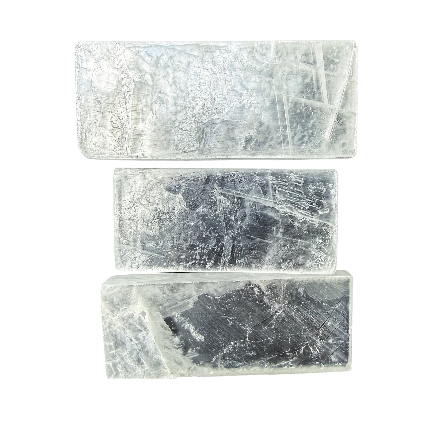 Selenite bars arranged in a column showing consistent width across pieces