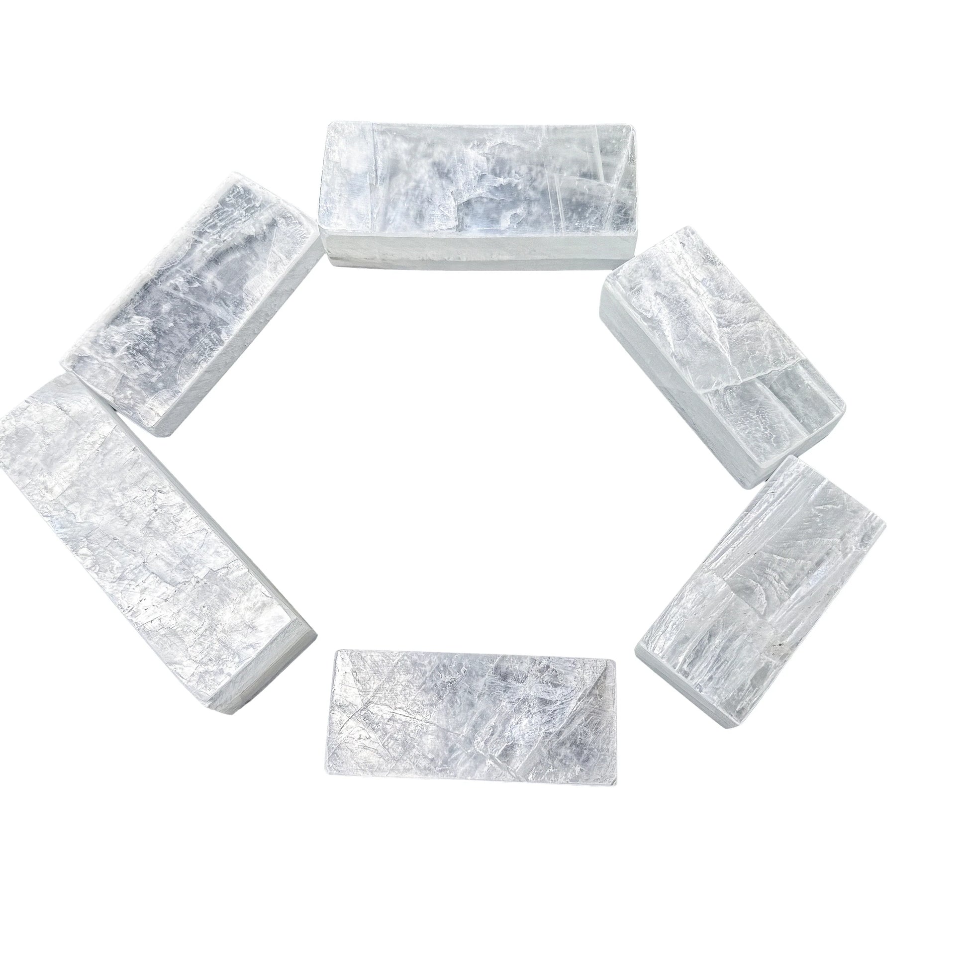 Selenite bars fanned outward from centre showing the full set together
