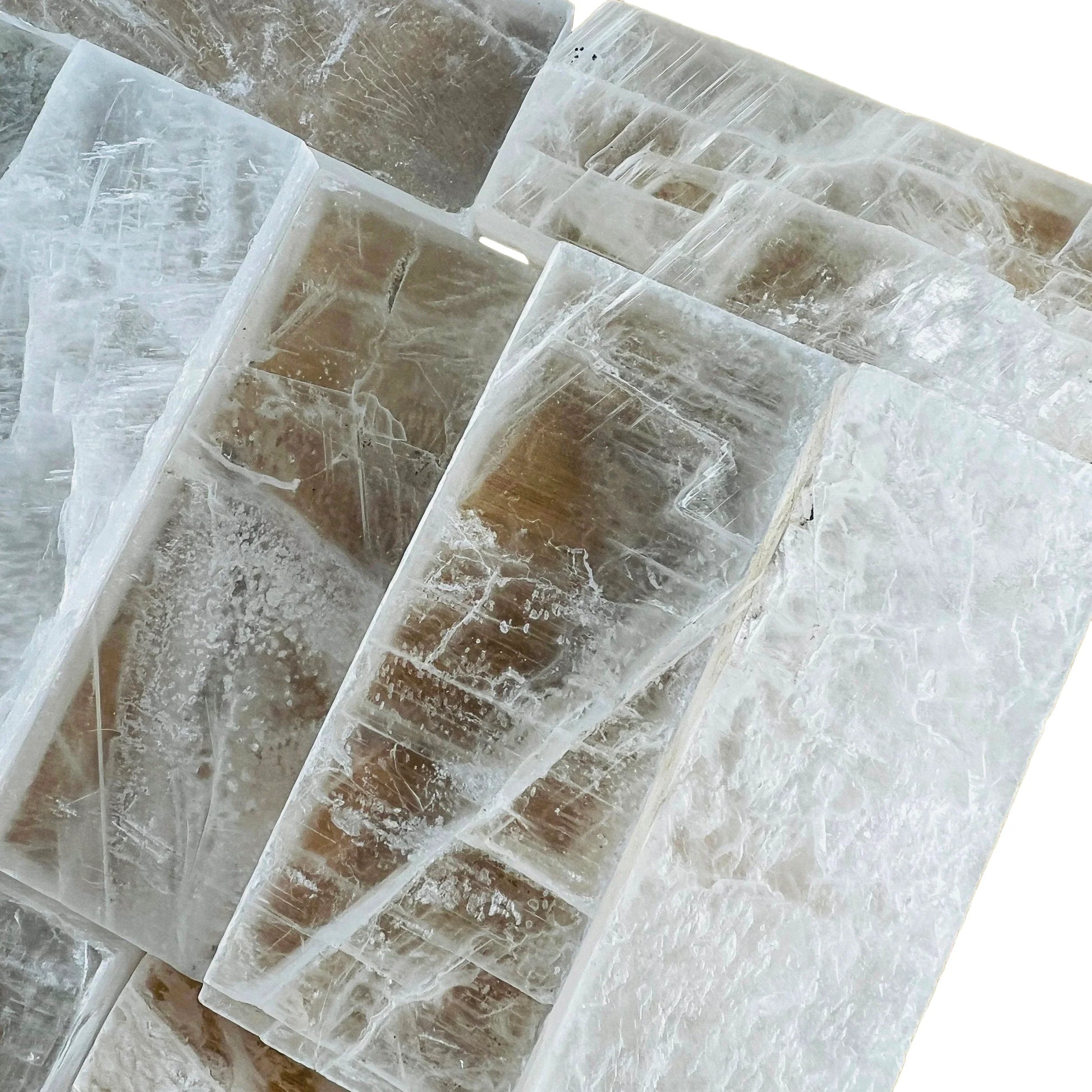 Near view of Grade AAA white Selenite raw stone, showing natural form, linked to Cleansing.