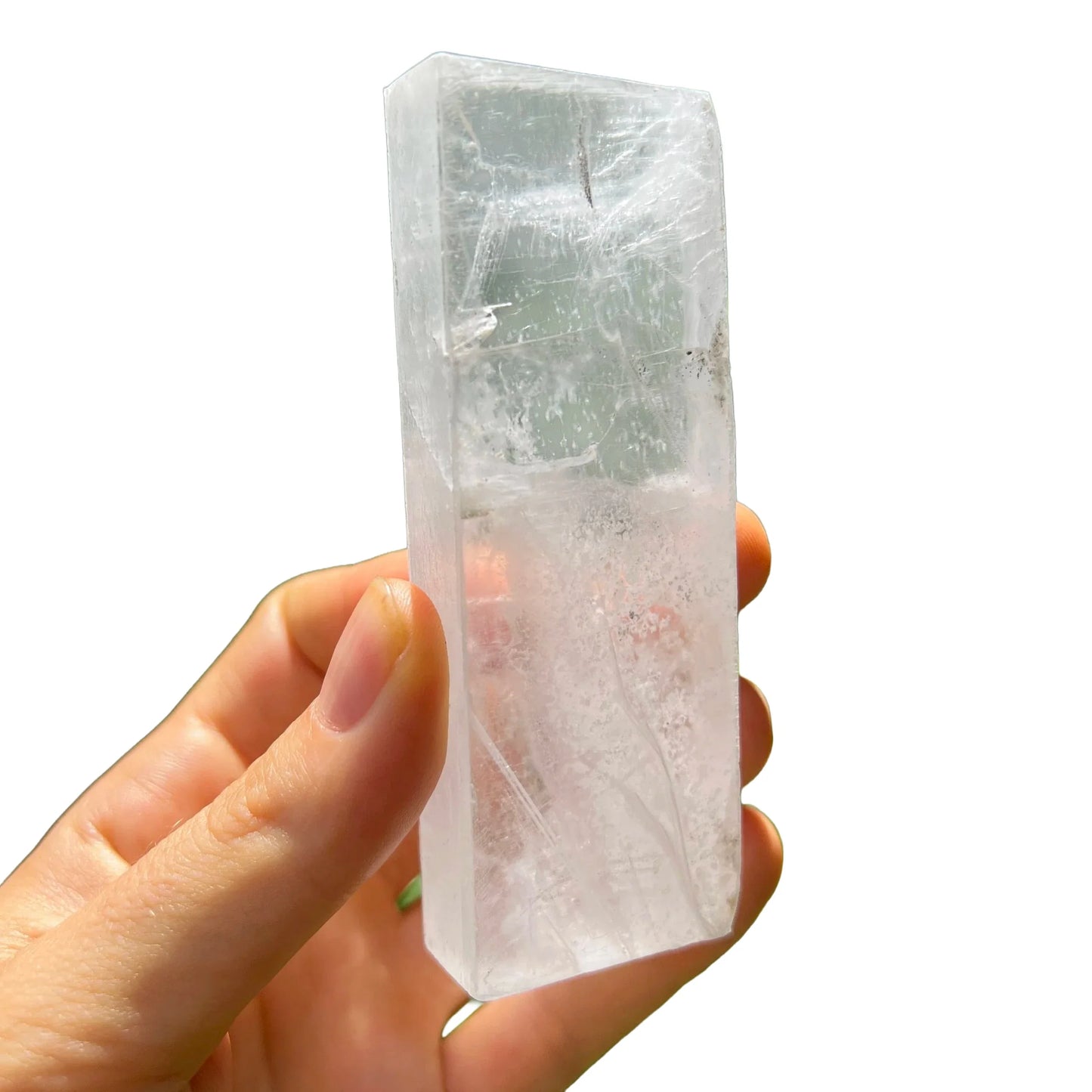 Top-down shot of Selenite raw stone, showing natural banding.