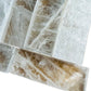 Detail shot of Grade AAA Selenite raw crystals under natural light