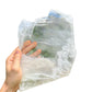 Holding a Selenite specimen, from New Mexico, Usa, traditionally used for Meditation, showing the wear and finish.