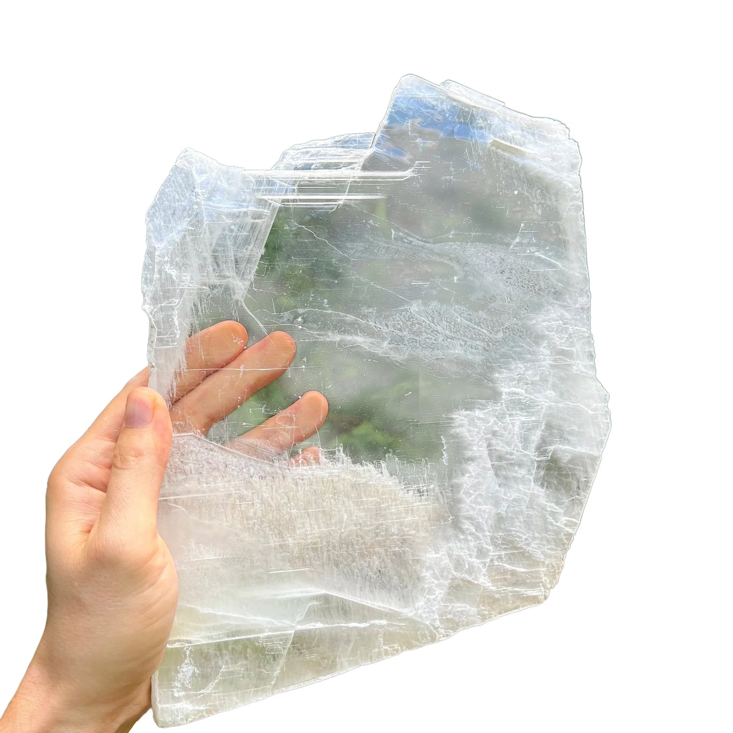 Holding a Selenite specimen, from New Mexico, Usa, traditionally used for Meditation, showing the wear and finish.