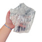Selenite clearing slab from New Mexico held in an open hand, backlit to show translucency, 1.98 pound piece, specimen 55.