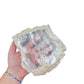 Selenite clearing slab from New Mexico held in an open hand, backlit to show translucency, 1.71 pound piece, specimen 56.