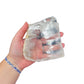 Selenite clearing slab from New Mexico held in an open hand, backlit to show translucency, 0.84 pound piece, specimen 58.