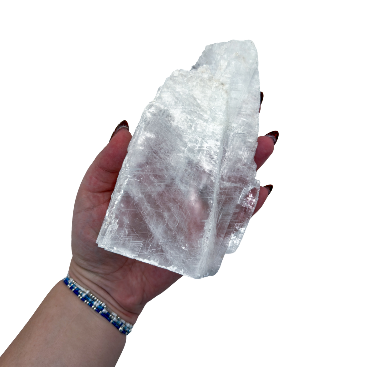 Selenite standing slab from New Mexico held in an open hand, showing the true scale of this 1.09 pound piece, specimen 70.