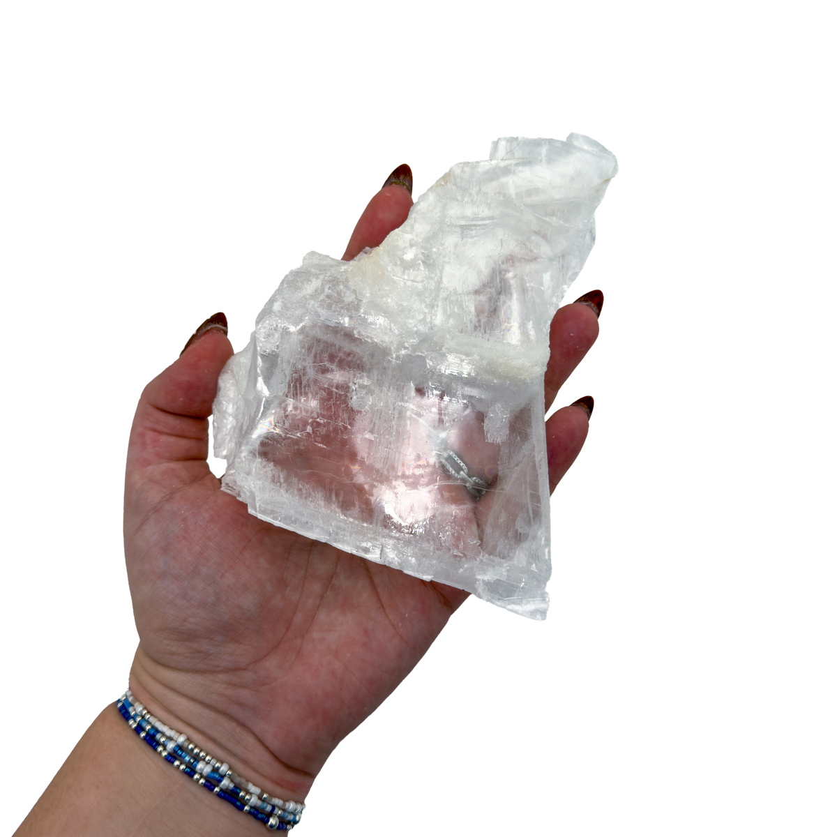 Selenite standing slab from New Mexico held in an open hand, showing the true scale of this 0.95 pound piece, specimen 71.