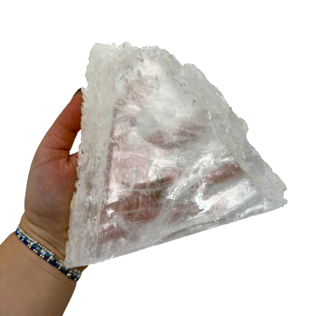 Selenite standing slab from New Mexico held in an open hand, showing the true scale of this 1.94 pound piece, specimen 72.