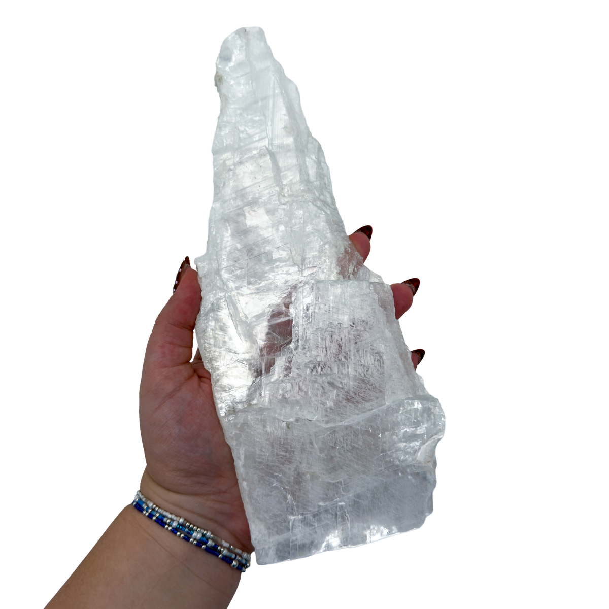 Selenite standing slab from New Mexico held in an open hand, showing the true scale of this 1.65 pound piece, specimen 73.
