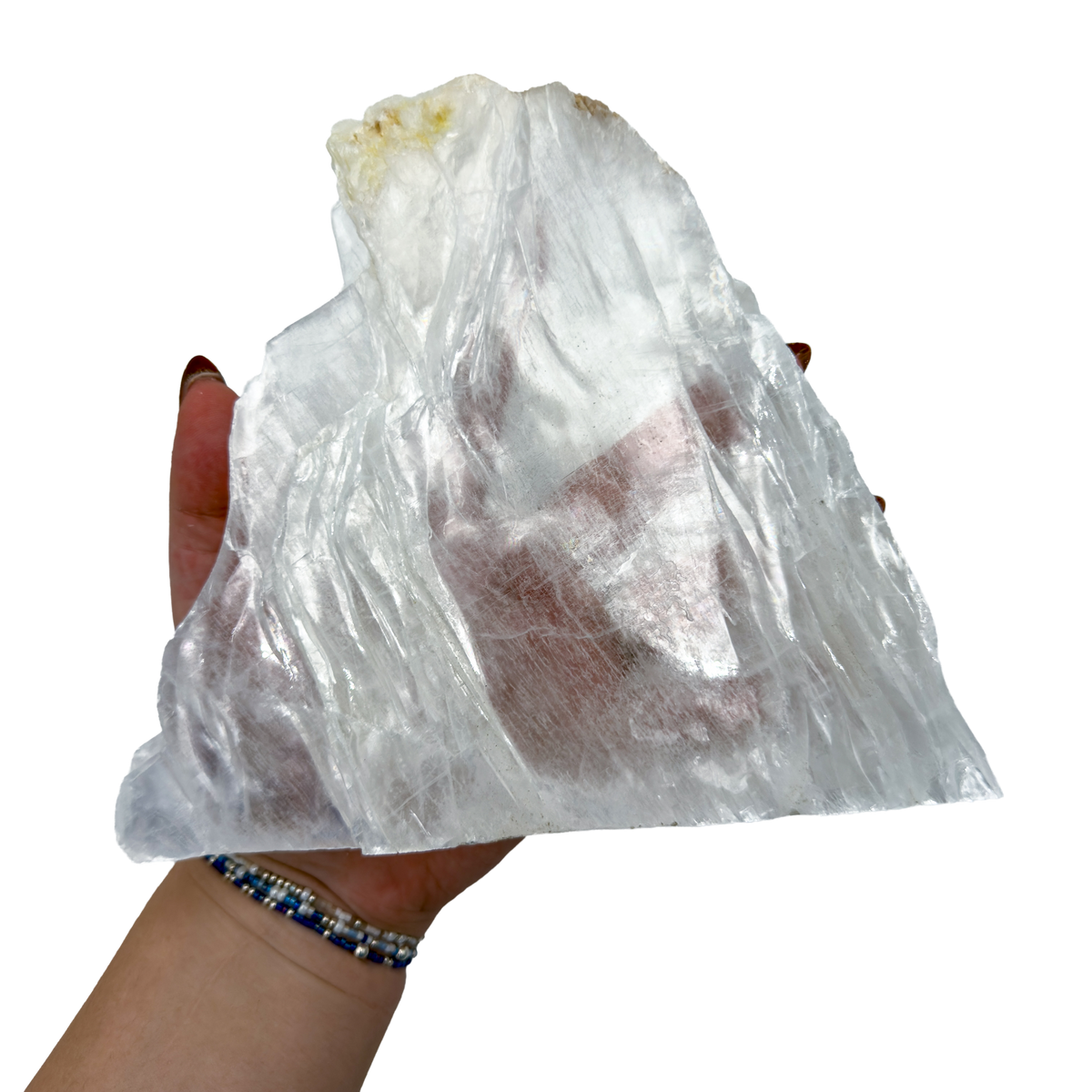 Selenite standing slab from New Mexico held in an open hand, showing the true scale of this 1.71 pound piece, specimen 75.