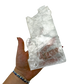 Selenite standing slab from New Mexico held in an open hand, showing the true scale of this 2.32 pound piece, specimen 76.