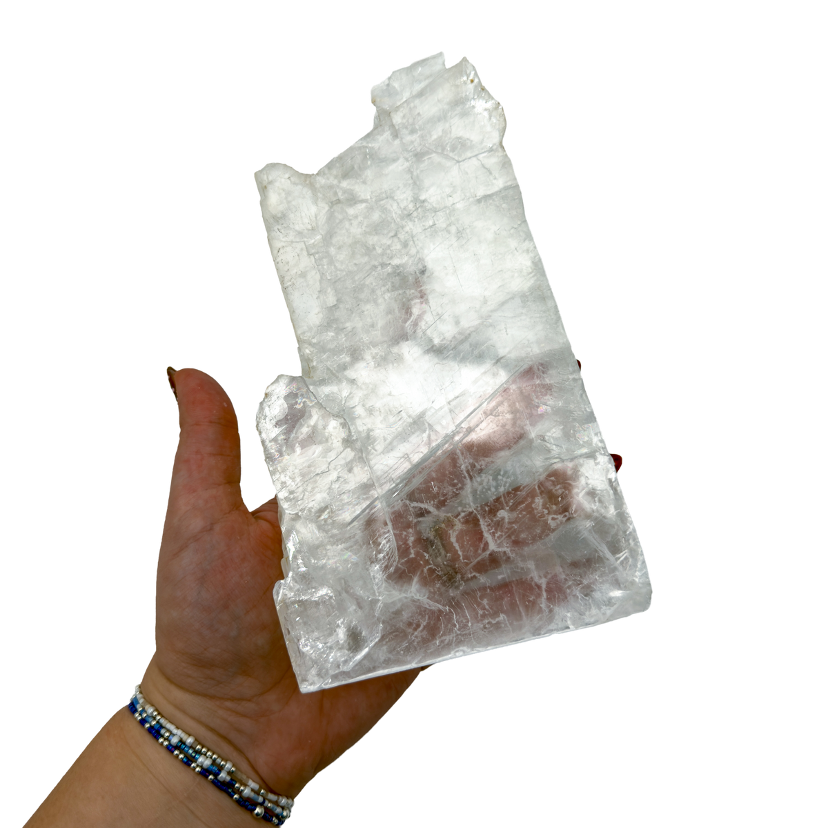 Selenite standing slab from New Mexico held in an open hand, showing the true scale of this 2.32 pound piece, specimen 76.