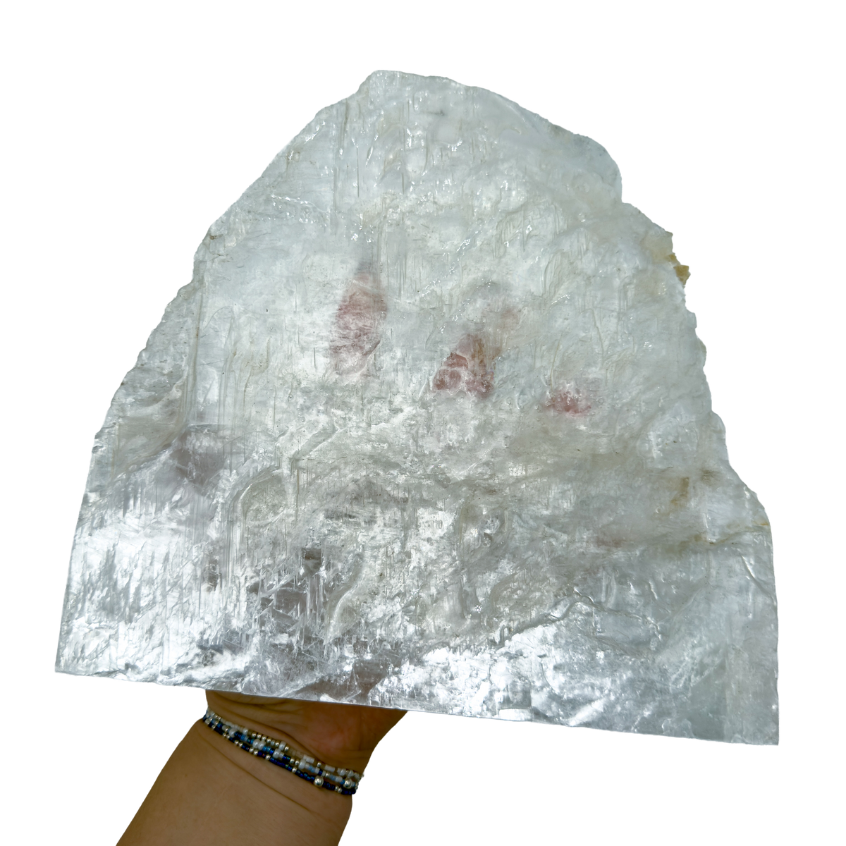 Selenite standing slab from New Mexico held in an open hand, showing the true scale of this 3.35 pound piece, specimen 77.