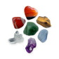 The Seven Chakra Kit: red jasper, carnelian heart, tiger eye, green aventurine, blue lace agate, amethyst point and clear quartz cluster, shown together on white