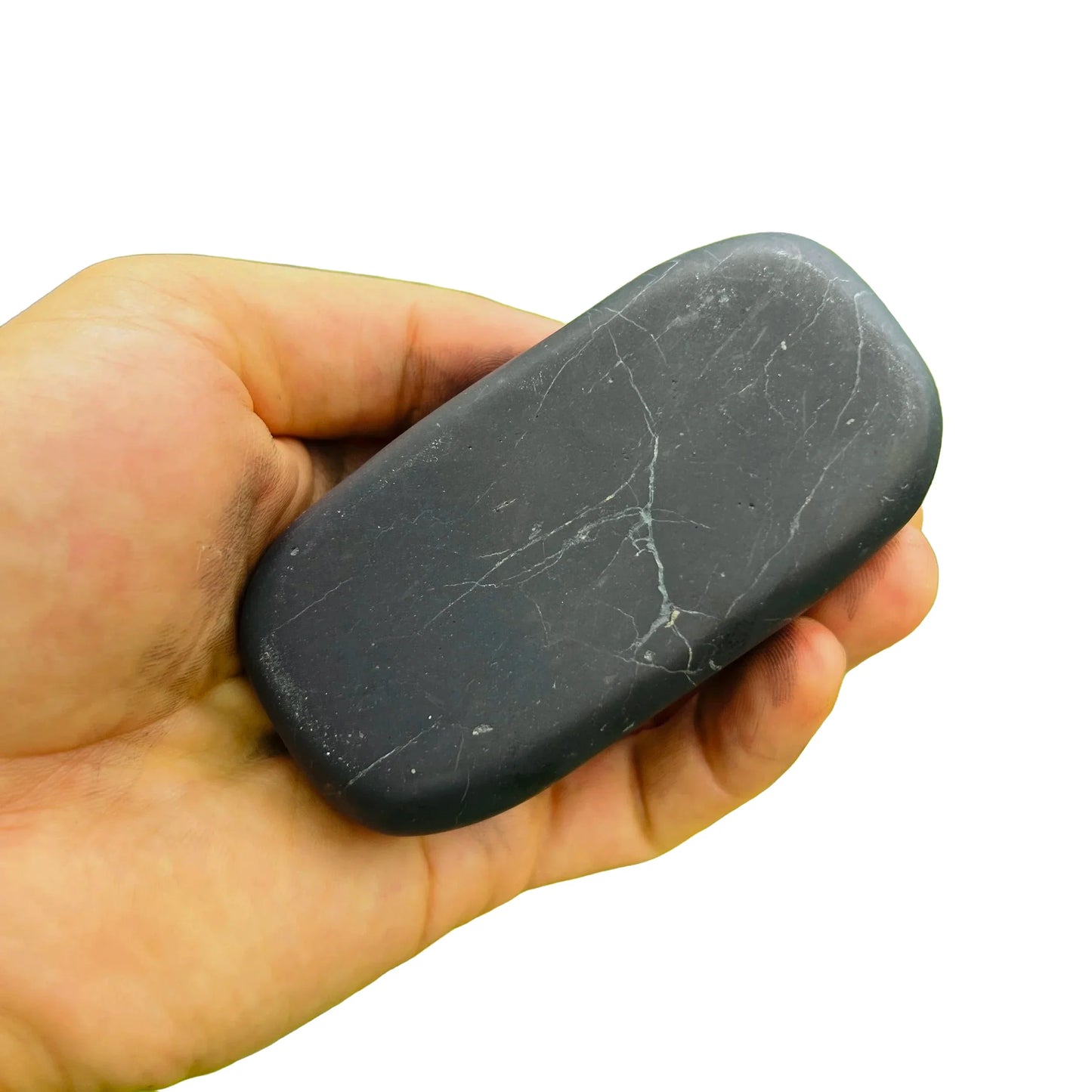 Grain detail of Shungite palm stone, often worked with for Protection, showing translucent edges.