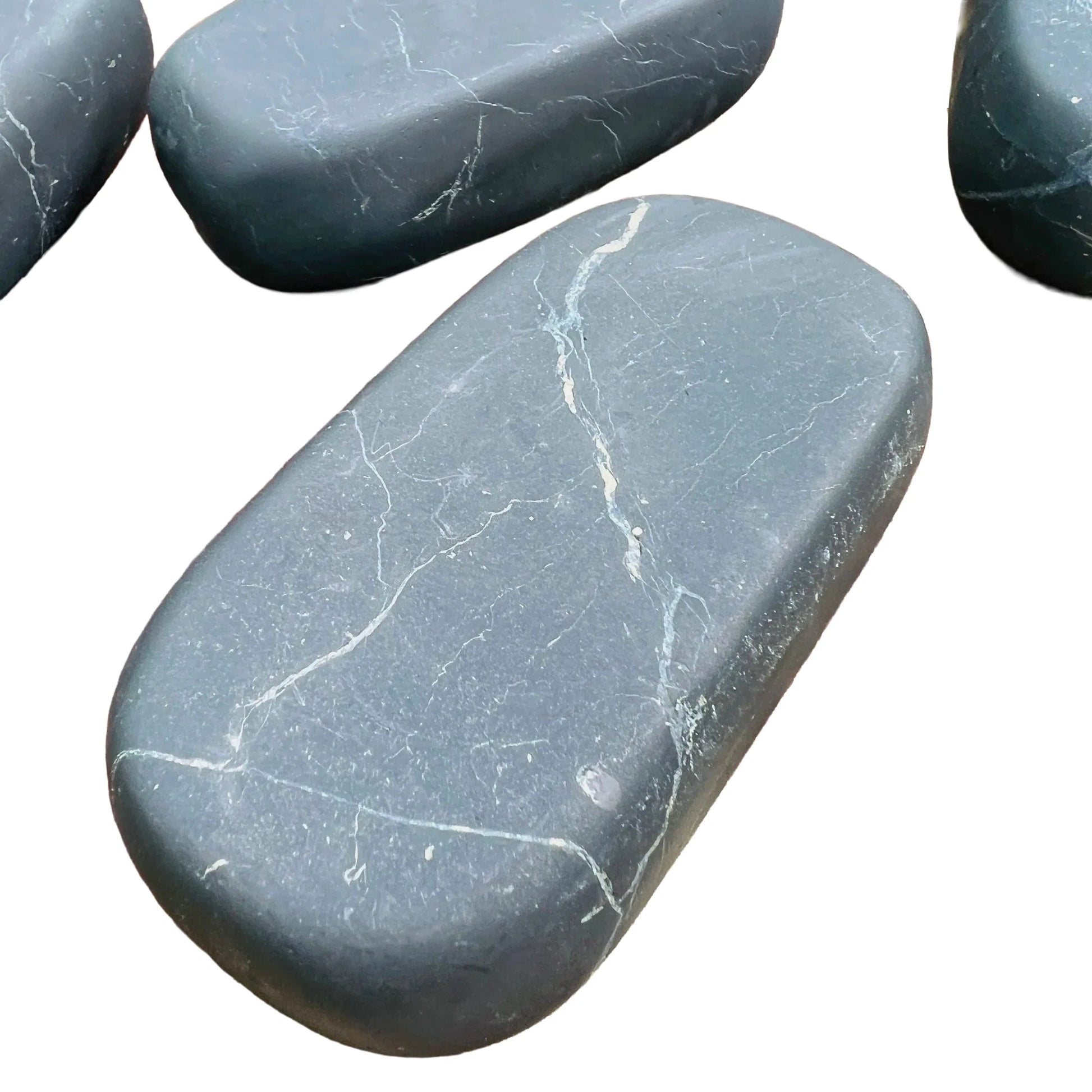 Reverse angle of black Shungite palm stone, showing earthy tone, worked with for Protection.