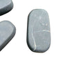 Back view of Grade Type III - Regular Grade Shungite palm stone showing natural surface