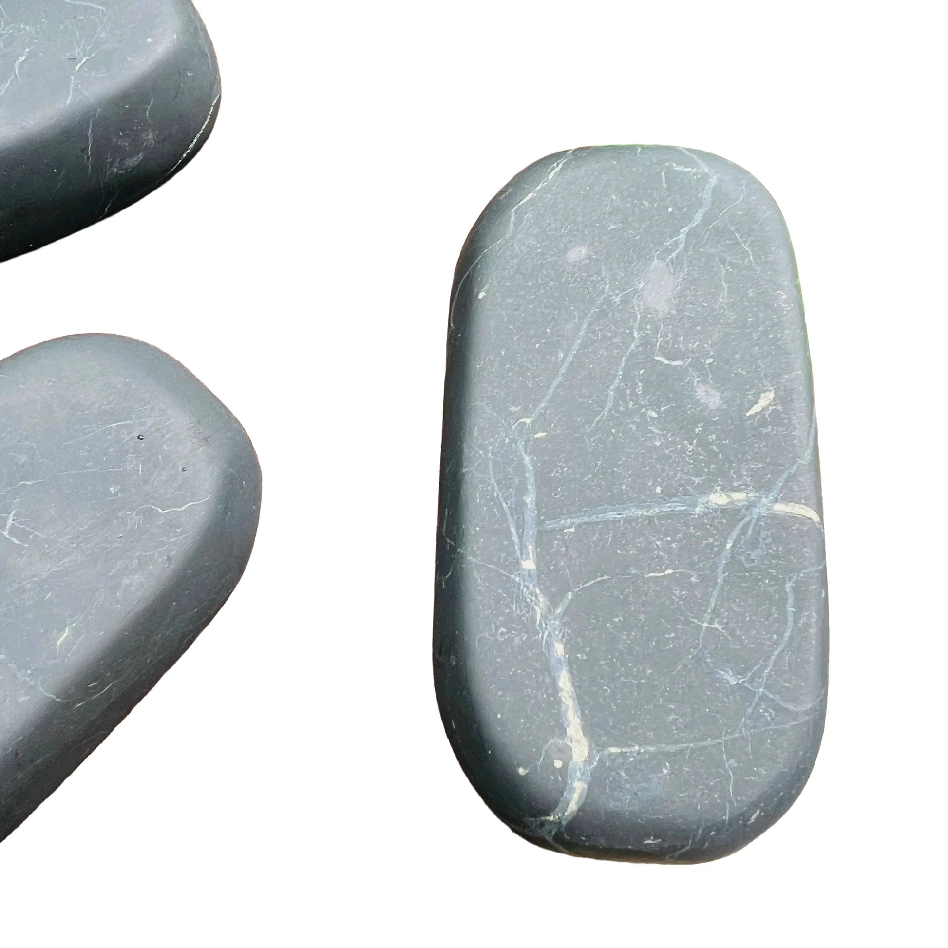 Back view of Grade Type III - Regular Grade Shungite palm stone showing natural surface