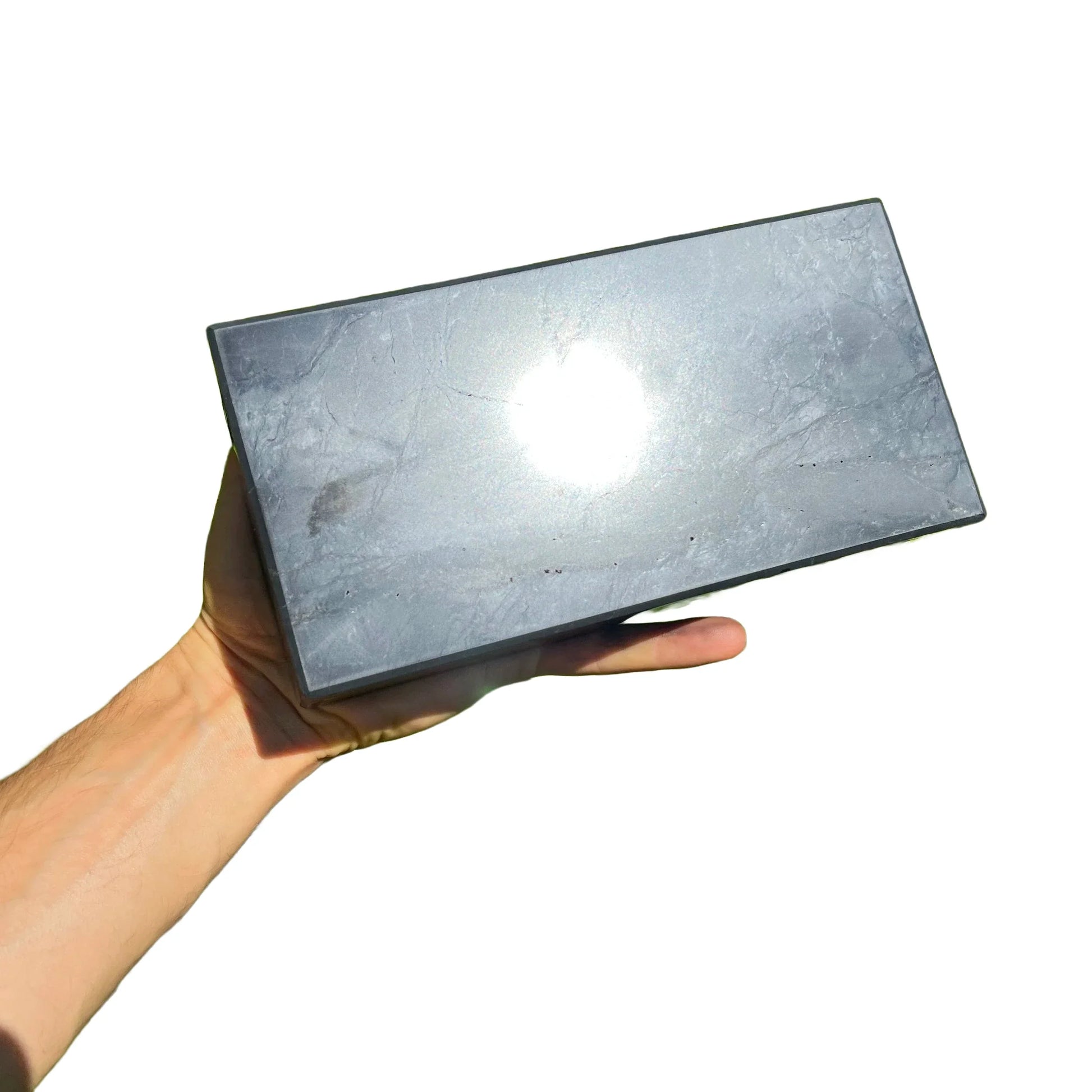 Size comparison with one Shungite polished block for scale, sourced from Republic of Karélia, Russia.