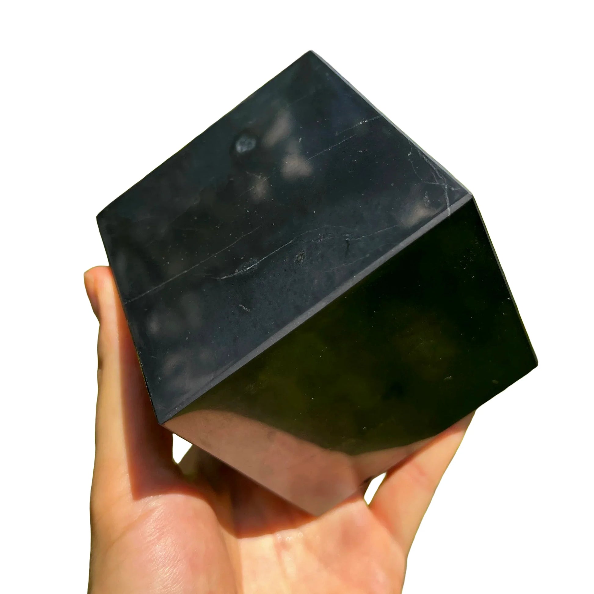 Grain detail of Shungite polished cube, traditionally used for Protection, from Republic of Karélia, Russia.